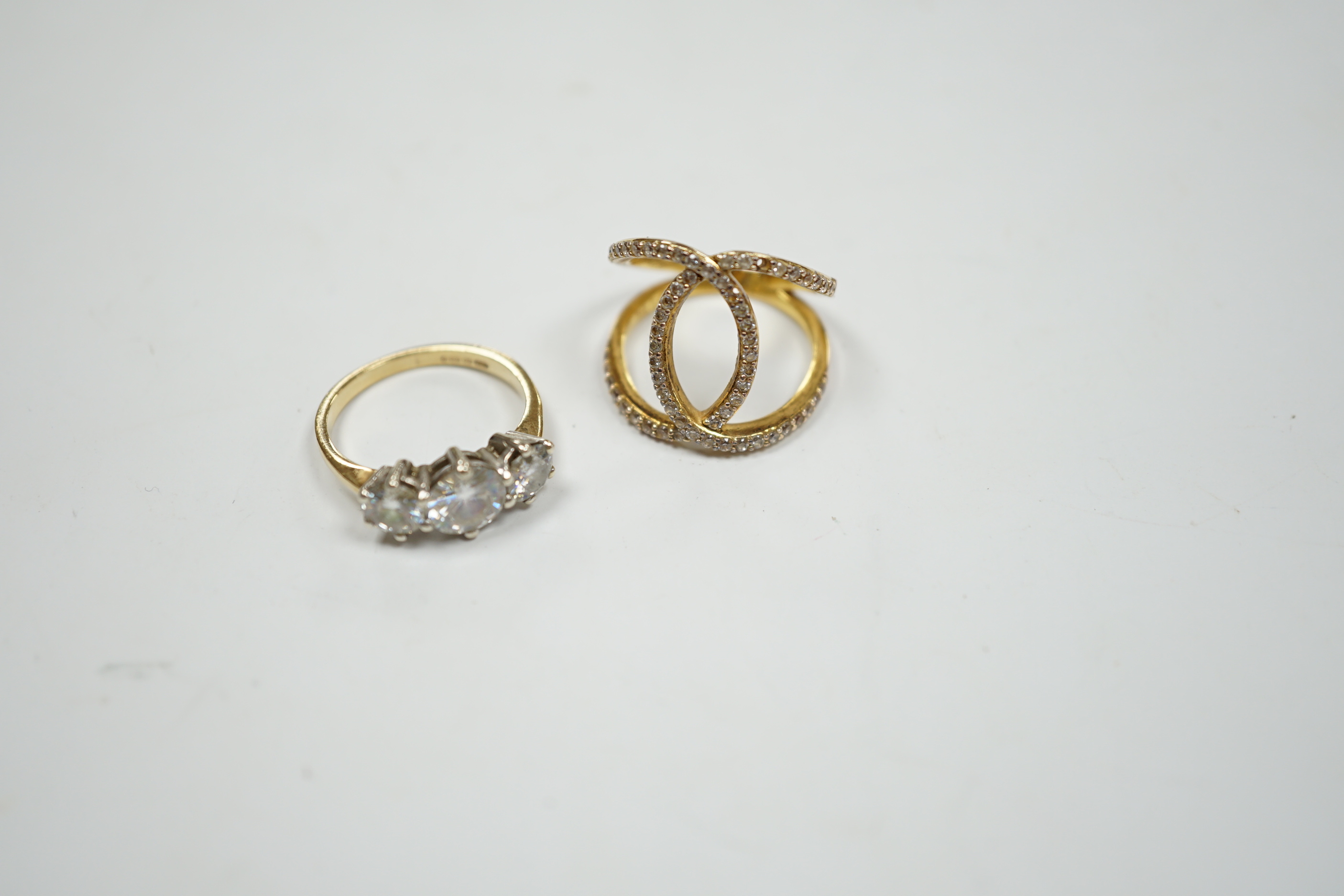 A 9ct gold and three stone simulated diamond ring and a gilt 925 ring.